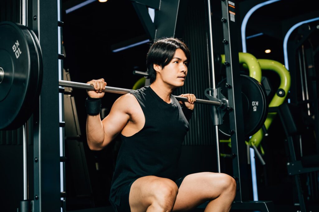asian-muscular-man-guy-performing-a-squat-exercise-2026-01-08-06-43-12-utc.jpg